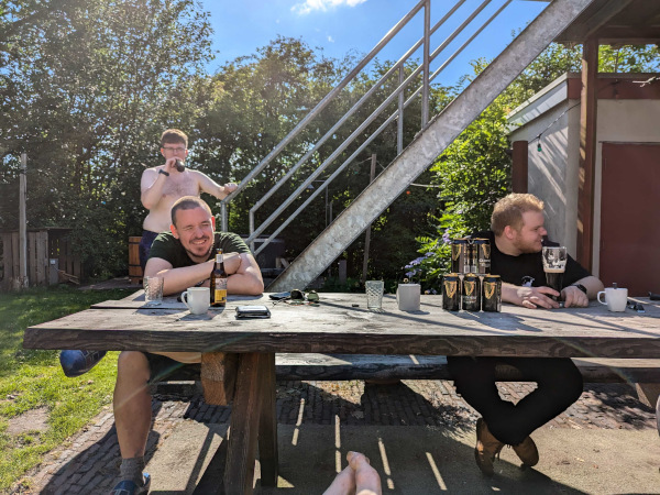 resting and smiling, while sitting on a bench